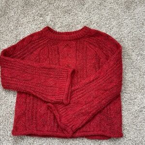 Red knit bell sleeve sweater